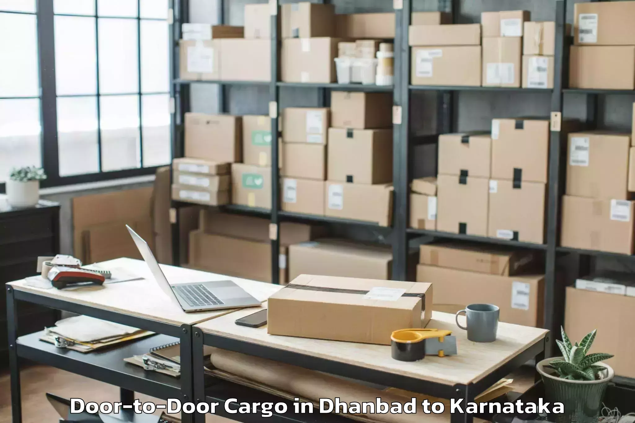 Reliable Dhanbad to Garuda Swagath Mall Door To Door Cargo